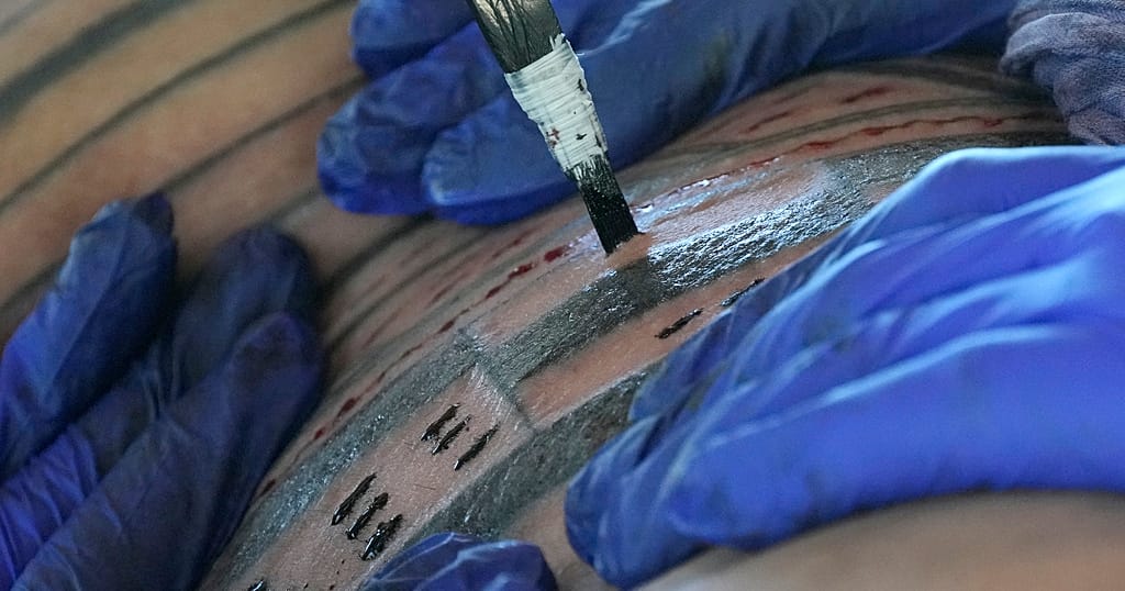 Researchers find evidence of youngest-ever children tattooed