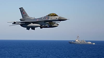FILE: A Turkish F16 fighter jet flies over naval ships during an annual NATO naval exercise on Turkey's western coast on the Mediterranean, Thursday, Sept. 15, 2022.