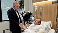 In this photo released by the Prime Minister office, Australian Prime Minister Anthony Albanese meets Ahmed al Ahmed at St George Hospital in Sydney, Tuesday, Dec. 16, 2025.