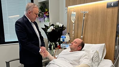 In this photo released by the Prime Minister office, Australian Prime Minister Anthony Albanese meets Ahmed al Ahmed at St George Hospital in Sydney, Tuesday, Dec. 16, 2025.