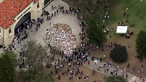 Aerial of huge floral tributes at vigil at Bondi Beach in Sydney