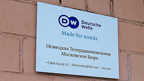 The sign of the Moscow office of German public broadcaster Deutsche Welle is seen on the wall of an apartment building in Moscow, 4 February, 2022