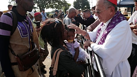 Cardinal Juan de la Caridad García blesses devotees taking part in the annual Saint Lazarus procession