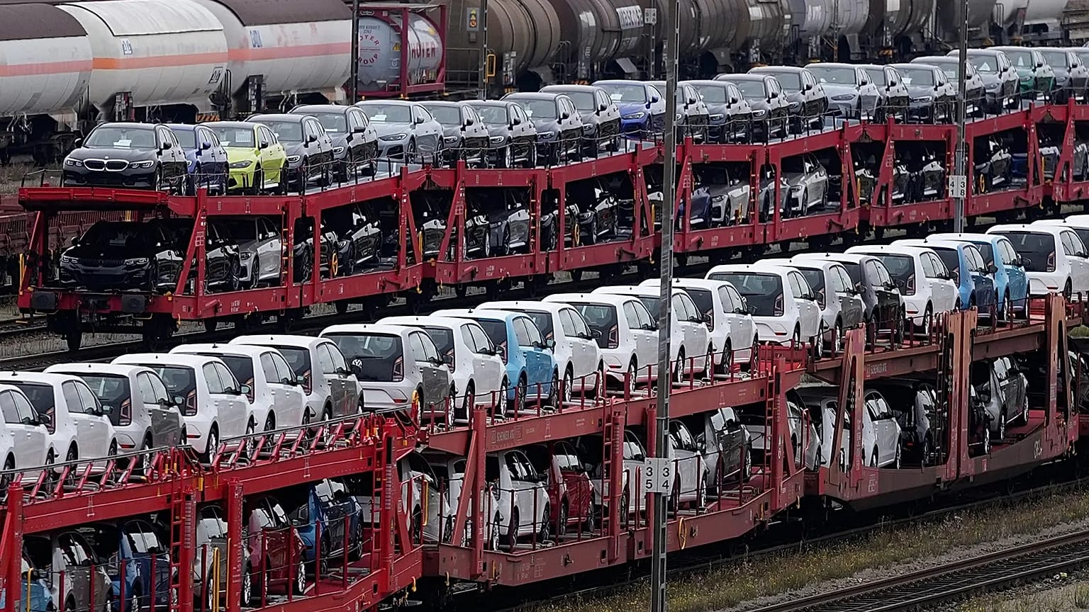 Brand new cars of German car manufacturer Volkswagen and BMW are parked on a freight train in Munich, 14 October, 2021