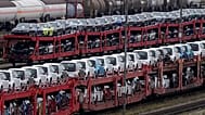 Brand new cars of German car manufacturer Volkswagen and BMW are parked on a freight train in Munich, 14 October, 2021