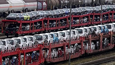 Brand new cars of German car manufacturer Volkswagen and BMW are parked on a freight train in Munich, 14 October, 2021