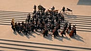A scene from Nabd Qatar featuring the Qatar Philharmonic Orchestra 