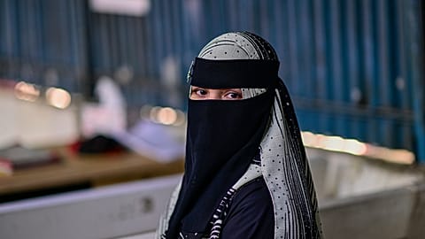 A Rohingya refugee girl, sits inside the Rohingya refugee camp in Cox's Bazar, Bangladesh, 20 November 2025