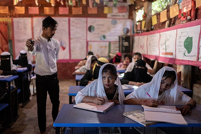 Rohingya refugee girls attend a class at their school in the refugee camp in Cox's Bazar, 26 November, 2025