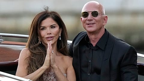 FILE - Lauren Sanchez Bezos, left, and Jeff Bezos depart from the Aman hotel during wedding celebrations in Venice, Italy. 28 June 2025.