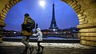 A child goes to school in front of the Eiffel Tower in Paris, 18 January, 2024 