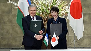 President of Uzbekistan Shavkat Mirziyoyev and Japan’s Prime Minister Sanae Takaichi exchange signed documents following talks in Tokyo