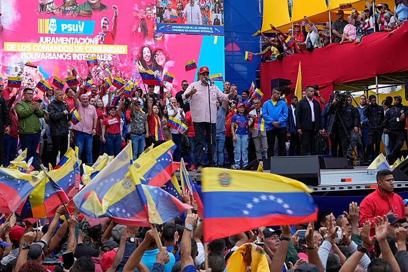 FILE: Venezuelan President Nicolas Maduro addresses supporters during a swearing-in event for community committees at the presidential palace in Caracas, 1 December 2025