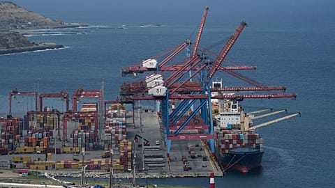 FILE - A cargo boat is docked below cranes at the seaport in La Guaira, Venezuela. 17 December 2025.