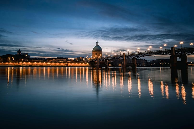 View of Garonne River and the Pont Saint-Pierre bridge at dusk