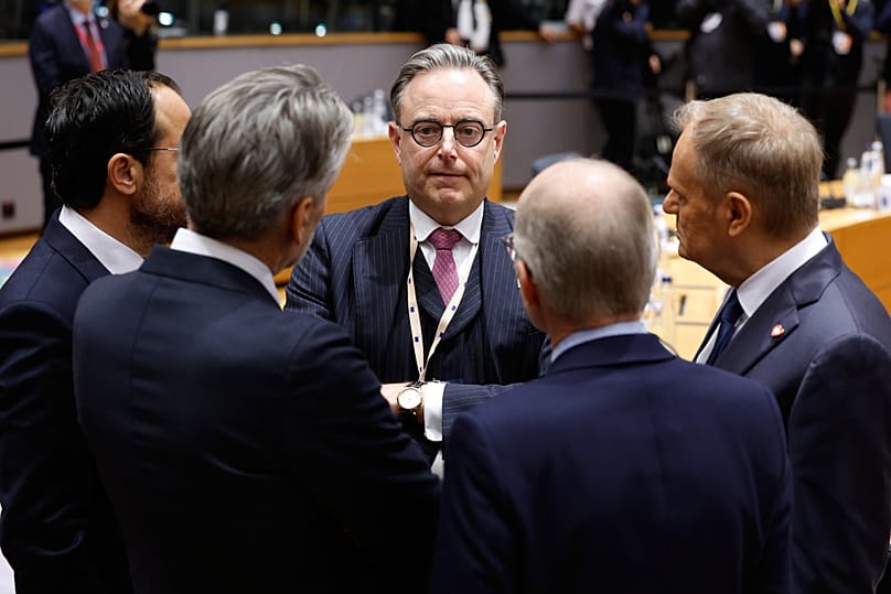 Belgium's Prime Minister Bart De Wever speaks to other EU leaders  during a round table meeting at the EU Summit in Brussels, 18 December 2025