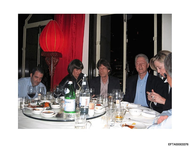 Ghislaine Maxwell, second from left, next to Mick Jagger, centre, and former President Bill Clinton, third from right. (US Department of Justice, AP)