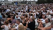 Attendees listen to David Ossip, president of the New South Wales Jewish Board of Deputies, during a ceremony to mark the  at Bondi Beach in Sydney, Sunday, 21 December 2025. 