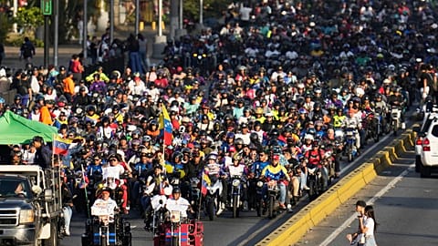 Government supporters ride motorbikes through Caracas, Venezuela