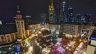FILE - People visit on the Christmas Market in the city centre in Frankfurt, Germany, Saturday, Dec. 20, 2025. (AP Photo/Michael Probst)