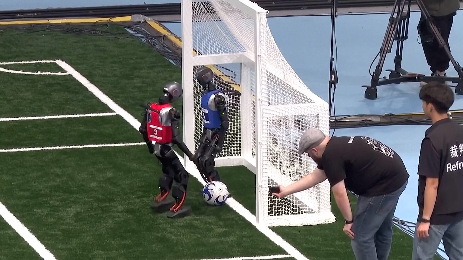 Robotic soccer game at the World Humanoid Robot Games in Beijing, China. 14 August 2025.