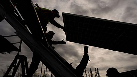 Workers install panels at a solar project May 21, 2025, in Galena, Alaska. 