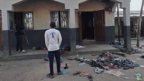 People inspect the scene of a deadly bomb explosion at a mosque in Maiduguri, Nigeria, Thursday, Dec. 25, 2025.