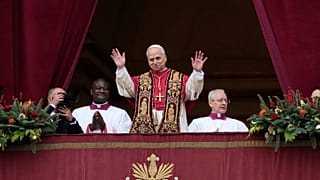 Pope Leo XIV waves after delivering the Urbi et Orbi Christmas Day blessing from the main balcony of St. Peter's Basilica at the Vatican, 25 December 2025