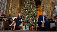 US President Donald Trump accompanied by first lady Melania Trump during a NORAD Tracks Santa Operation call at his Mar-a-Lago, 24 December 2025