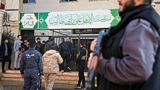 Syrian security forces gather outside the Imam Ali bin Abi Talib Mosque after an explosion in the predominantly Alawite Wadi al-Dhahab neighbourhood of Homs, 26 December 2025
