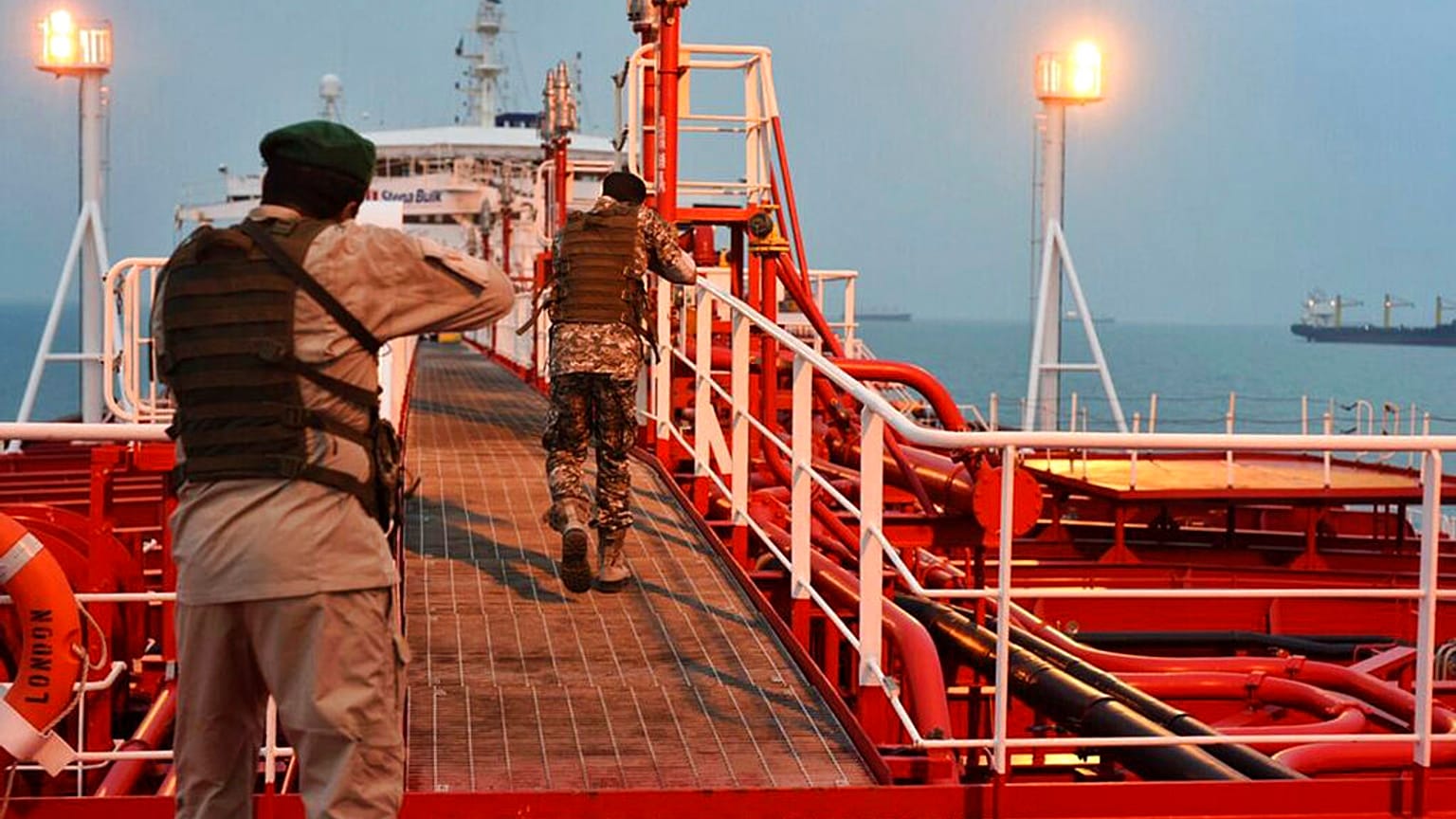 FILE: Two armed members of the IRGC inspect the UK-flagged oil tanker Stena Impero, seized in the Strait of Hormuz on Friday by the Guard, 19 July 2019