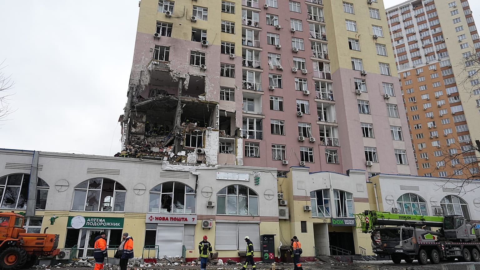 Rescuers work on the scene of a building damaged by a Russian attack in Kyiv, Ukraine, Saturday, Dec. 27, 2025. (AP Photo/Efrem Lukatsky)