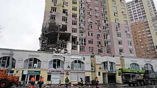 Rescuers work on the scene of a building damaged by a Russian attack in Kyiv, Ukraine, Saturday, Dec. 27, 2025. (AP Photo/Efrem Lukatsky)