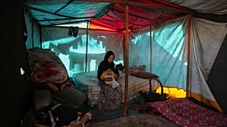 Displaced families in Gaza struggle against rain and cold in makeshift structures