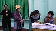 Voters register at a polling station in Naypyitaw, Myanmar, Sunday, Dec. 28, 2025. (AP Photo/Aung Shine Oo)