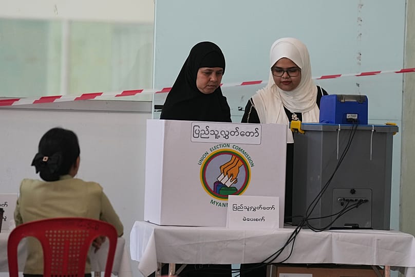 Voters cast their ballots at a polling station Sunday, Dec. 28, 2025, in Yangon, Myanmar. (AP Photo/Thein Zaw)