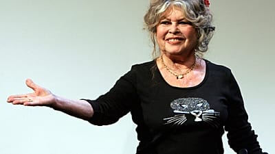 In this Sept. 28, 2006 file photo, Brigitte Bardot acknowledges applause in Paris as she and Sophie Marceau campaign for animal welfare ahead of a 2018 parliamentary debate.