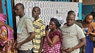 Voters queue at a polling station to cast their ballot in the presidential election in Bangui, Central African Republic, Sunday, Dec. 28, 2025.