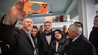 Kosovo's caretaker Prime Minister Albin Kurti is photographed with voters after exercising his right to vote in Pristina