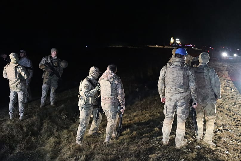 Turkish soldiers and rescue teams search for the remains of a private jet carrying Libya's military chief that crashed after taking off from Ankara, Dec. 23, 2025.