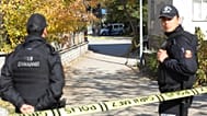 FILE: Security officials stand at the entrance of a house in the Turkish capital Ankara, 11 November 2022