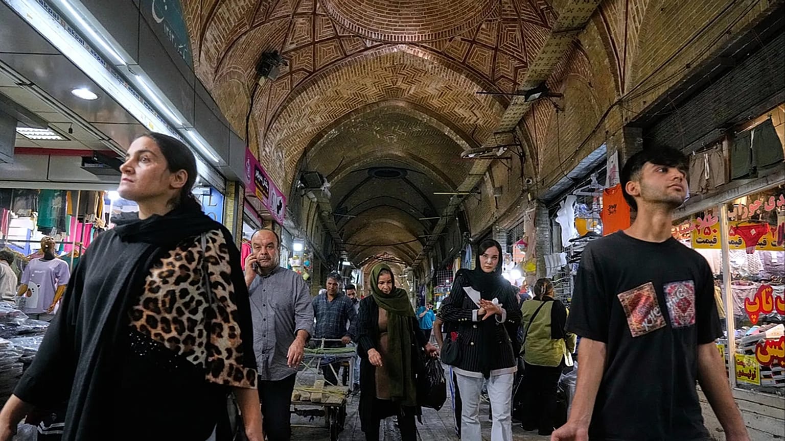 FILE - Your download is complete.  Live chat: Chat with an Expert  People walk through the old main bazaar of Tehran, Iran, 24 September 2025. (AP Photo/Vahid Salemi)