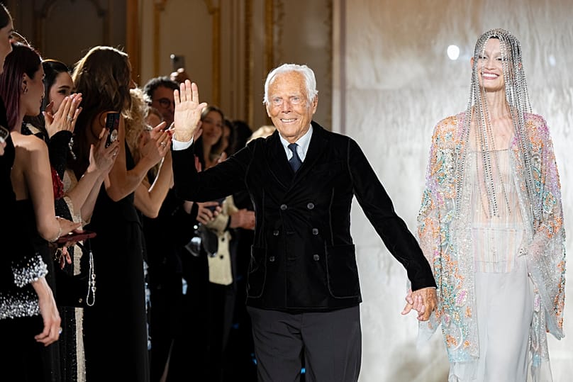 Giorgio Armani waves at the end of his Prive Haute Couture Spring/Summer 2025 collection in Paris, 2025.