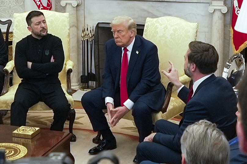 Vice President JD Vance, right, speaks with Ukrainian President Zelenskyy, left, as President Trump listens in the Oval Office at the White House, Feb. 28, 2025