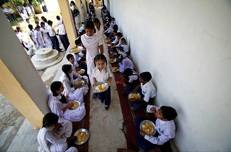 FILE: India's midday meal scheme is one of the world's biggest school nutrition programs, covering some 120 million school children.