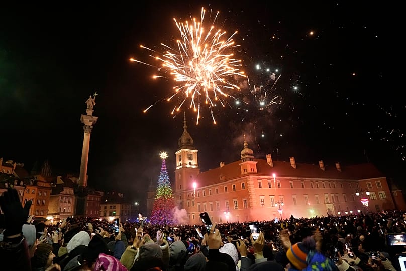 People watch the fireworks for the New Year's celebrations in Warsaw, 1 January, 2025
