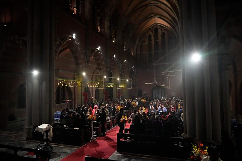 Pakistani Christians attend a prayer service on the first day of the New Year at Cathedral Church of the Resurrection in Lahore, 1 January, 2025