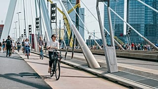 People cycling over a bridge in Rotterdam on 13 September, 2023. 