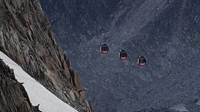Blocked cable car cabins hang from the Mont Blanc massif between France and Italy, Friday 9 September 2016. (AP Photo/Luca Bruno)