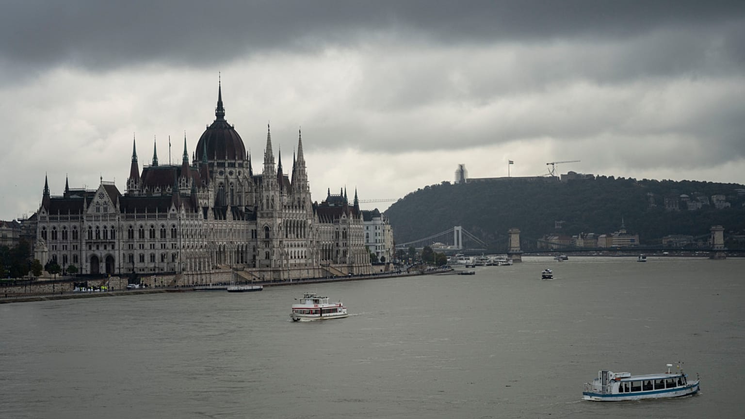 FILE - Dark clouds are seen over the Parliament building in Budapest, Hungary, during the flooding of the Danube river. 16 September 2024. 